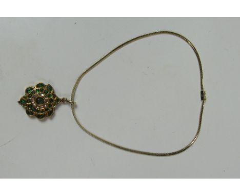 An unusual 14ct gold carved Emerald & Diamond Pendant, with enamel back in the Indian manner, with fine gold neck band or cha