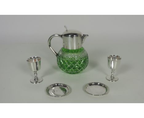 An unusual green cutglass Punch Jug, with heavy silver plated mount and handle, together with six plated goblets and 12 small