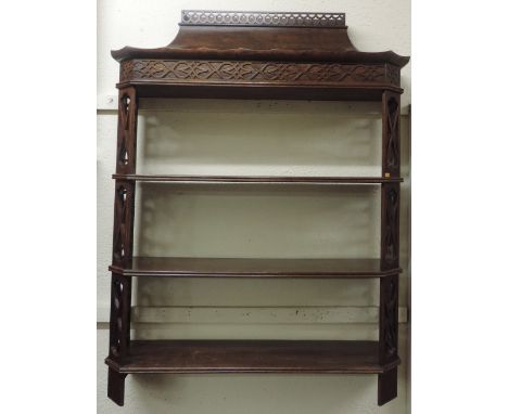 An attractive Chinese Chippendale style mahogany three shelf Wall Bracket, with pagoda style top and fretwork sides, 112cms x