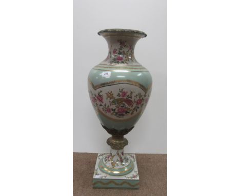 An attractive large brass mounted porcelain Urn, the bulbous body with a light green ground and a panel of bright pink flower