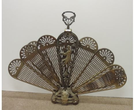 A large heavy brass peacock style Firescreen, with pierced folding leaves on scroll decorated stand. (1)