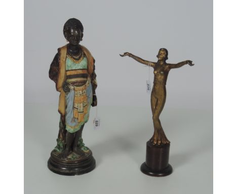 A gilt printed Art Deco style Figure of Female Entertainer, on wooden stand, overall height 36cms (14 1/4"); also a Majolica 