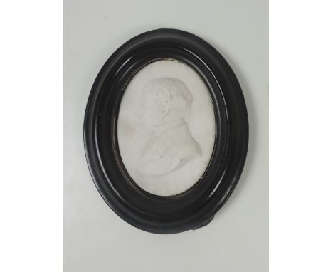 L. Luncyoli? 1858

A fine small oval carved marble panel, "Profile Portrait of a middle aged man with bow tie," signed with i