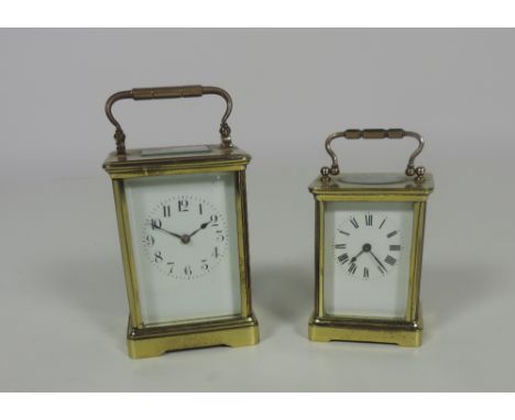 A heavy large brass Carriage Clock, and a smaller ditto. (2)