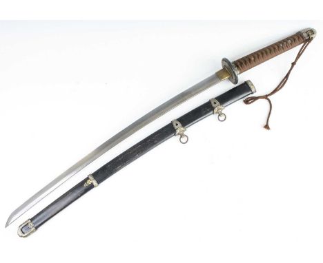 A Japanese Katana, having a 73cm curved steel blade with undulating hamon, brass habaki, bronze tsuba and cord bound fish ski