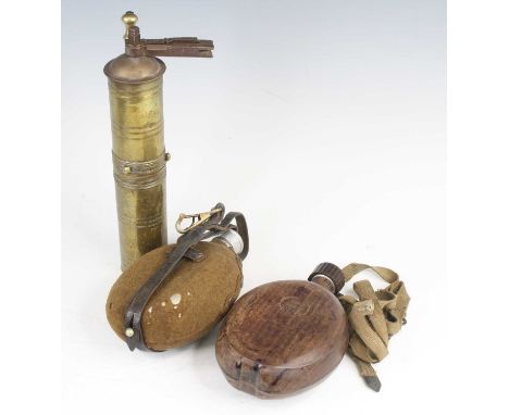 A German Armed Forces canteen, having a felt covered aluminium body and leather strap (lacking cup), the screw cap marked FSS