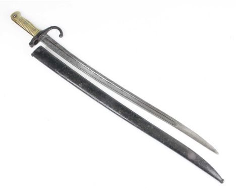 A French model 1866 chassepot bayonet, the 57cm fullered yataghan shaped steel blade etched to the back edge Mre Imp de St Et