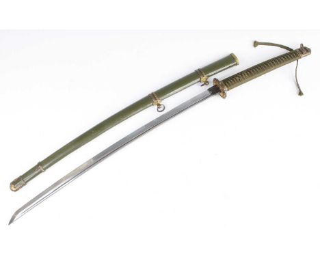 A Japanese Shin Gunto Katana, having a 70cm curved steel blade with undulating hamon, brass habaki, pierced iron tsuba and wr