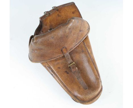 A pair of WW I  brown stitched leather saddle pouches, of typical form with folding top flaps and brass buckles, together wit
