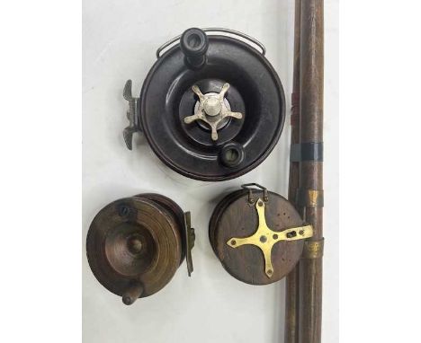 An Edwardian hand-made wooden and brass two piece fishing rod together with an Alvey Australian 525/A12/7 Bakelite sea reel a