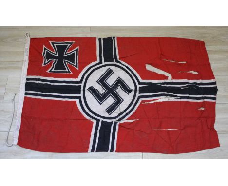A German Kriegsmarine battle flag, red cotton printed black and white cross with central white disc bearing black swastika; I