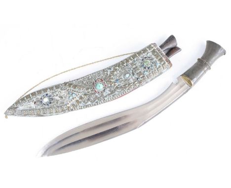A ceremonial kukri, having a 33cm curved steel blade and horn handle, in decorative leather covered and carbachon inset sheat