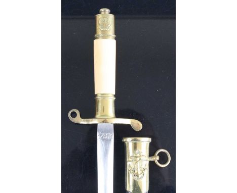 A Polish M1952 Naval stickert or dirk, having a 22.5cm double edged spear-point blade marked to the ricasso 32813, with gilt 