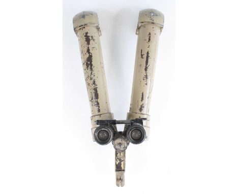 A pair of German Third Reich Afrika Korps rabbit ear binoculars, having light khaki tan painted tubular arms and adjustable l