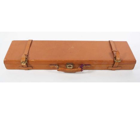 A modern brown leather shotgun case, having a green felt lined interior, w.81, d.21, h.9cm, together with a brown leather gun