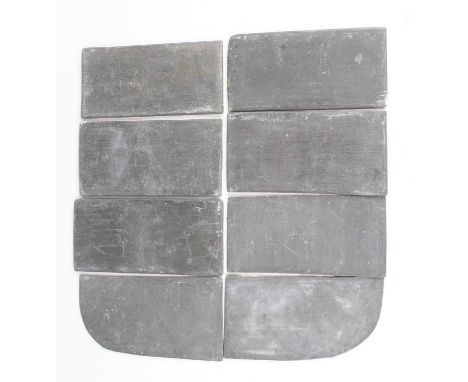 A collection of eight jockeys saddle weights, some with weights scratched on, none with any racecourse markings, together wit