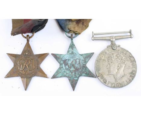 A collection of three WW II medals to include 1939-1945 Star, Atlantic Star and War medal, together with a silver War Badge n
