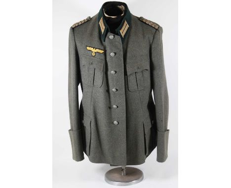 A German Third Reich Kriegsmarine Coastal Artillery? tunic, in green fabric with bullion shoulder straps, six front fastening
