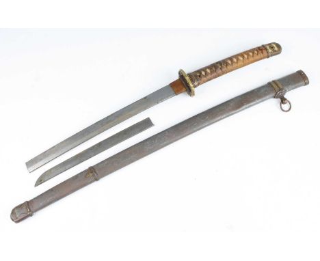 A Japanese shin gunto katana, the 69cm blade broken in two 29cm from the tip, having a signed tang, copper habaki, floral emb