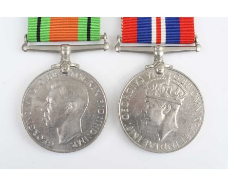 A WW II Defence and War medal pair, together with a Royal Air Force Volunteer Reserve form naming Rueben Arnold Teas?, dated 