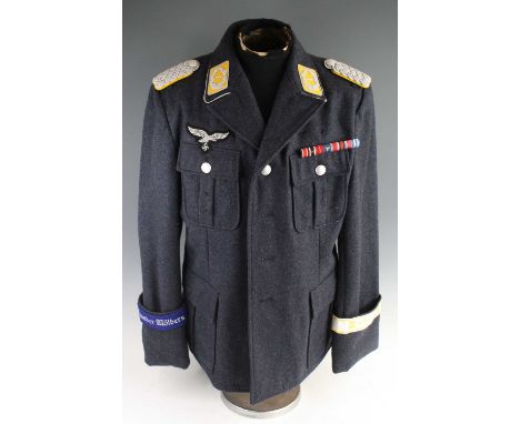 A German reenactors Luftwaffe officers tunic, displaying ribbon bar, embroidered cuff title, observers award and wired bullio