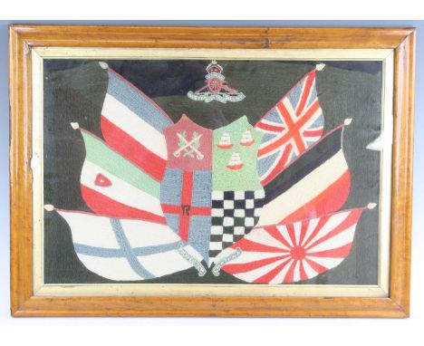 A late 19th / early 20th century woolwork panel, embroidered with the Royal Artillery crest above a central shield flanked by