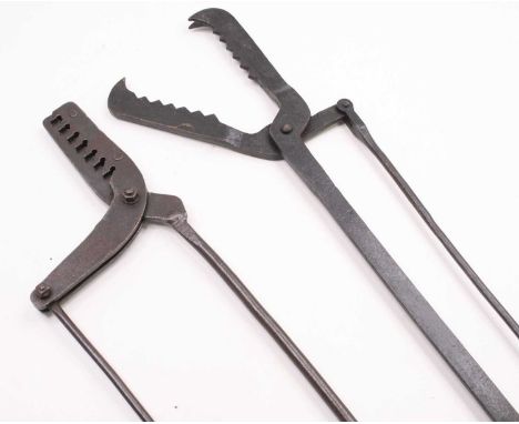 A 19th century iron frog gaff, having 14cm serrated jaws with scissor type action on long iron handles, 97cm, together with o
