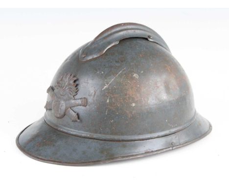 A French M15 Adrian pattern helmet, in blue finish with crossed cannons and grenade badge, with remains of leather lined inte