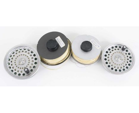 A small collection of fly fishing tackle to include two Hardy spools, three other spools, various flies and The Hardy Book Of