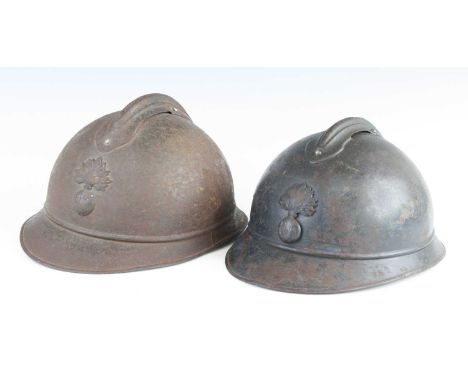A French M15 Adrian pattern helmet, with flaming grenade RF badge and leather lined interior, the rear skirt with what appear
