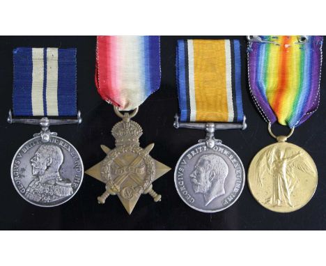 A Naval group of four medals to include Distinguished Service Medal (Geo. V uncrowned bust), naming F.2096. W. SMITH, P.O. ME