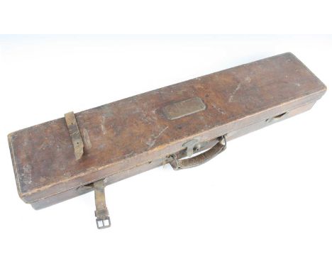 An early 20th century brown leather shotgun case having a green felt lined interior, together with a brown leather leg 'o mut