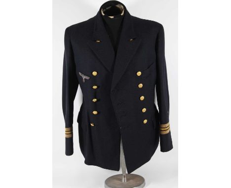 A German Third Reich Kriegsmarine Weapons Officers blazer, in dark blue cloth with bullion breast eagle and two rows of five 