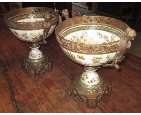 COMPORTS, a pair, with decorative crackle glaze ceramic bowl supports with classically stylised patinated metal mounts, 22.5c