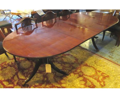 DINING TABLE, Regency design figured mahogany raised upon turn pillar tripod supports with two additional leaves, 122cm D x 2