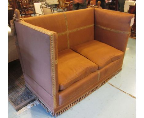 KNOWLE SOFA, with drop down sides and brown upholstery having a tasselled fringe, 153cm W. (with faults)