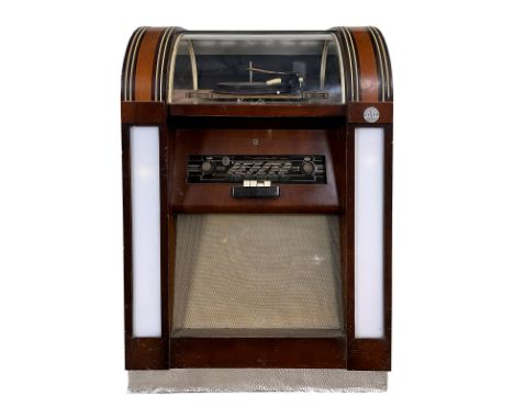 1953 Telfa Belgian Coin-Op Radio and Record Player. 12 selections for playing 33, 45 and 78 RPM records. It comes with 1 reco