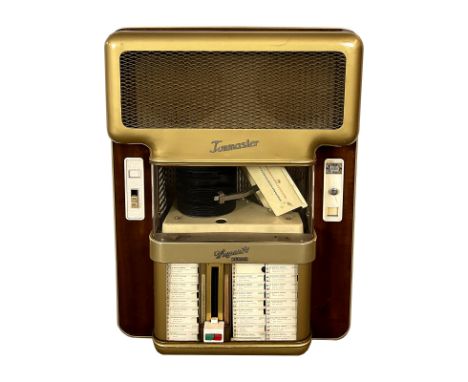 1956-1961 Wiegandt Tonmaster Wall Jukebox. 60 selection jukebox playing 45 RPM records. It comes with 30 records. The jukebox