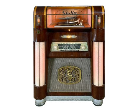 1954 Belgian Stella 531 Coin-Op Record Player with Built-In Radio. 12 record selections playing 33, 45 or 78 RPM records. It 