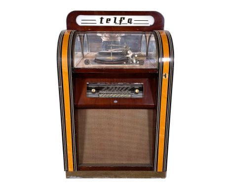 1954 Telfa Belgian Magic Music F.S. Coin-Op Radio and Record Player. It plays 33, 45 and 78 RPM records with 12 selections. T