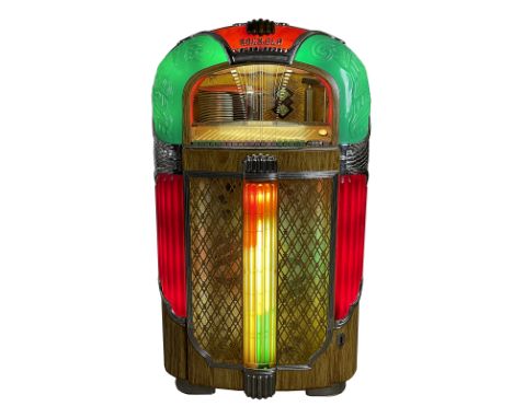 1948-1949 Rockola 1428 "Magic-Glo" Jukebox. 20 selection jukebox playing 78 RPM records. It comes with 20 records. The jukebo