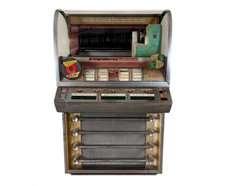 1955 Seeburg V200 Jukebox. 200 selection jukebox playing 45 RPM records. It comes with 97 records. The jukebox isn't fully or