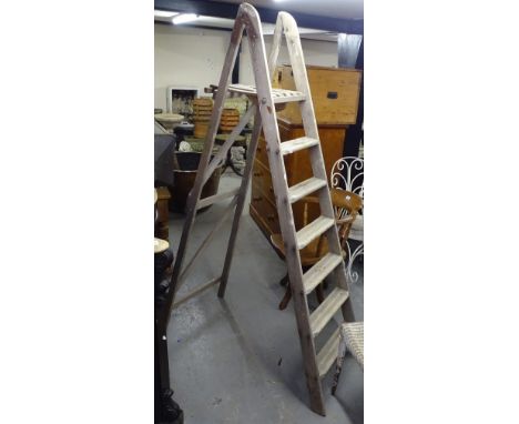 A pair of Vintage pine step ladders 
