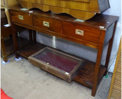 A Campaign style hardwood sideboard, with 3 frieze drawers and shelf below, W137cm, H84cm 