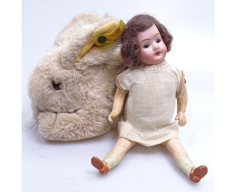A Steiff rabbit, and a German porcelain-headed doll with painted wooden limbs, 20cm 