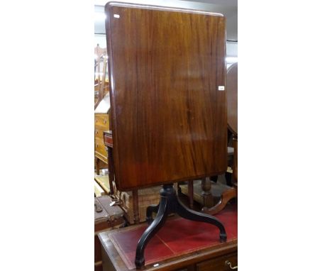A Georgian mahogany rectangular-top table on tripod base 