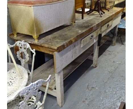 A large plank-top pine workbench, with 2 drawers and shelf under, L274cm, H92cm, D79cm 