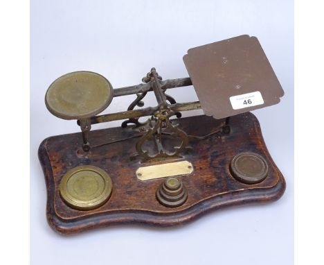 A brass and oak postal scale and weights, 30.5cm 