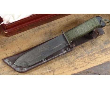 A British Ministry of Defence Army Survival Knife by Adams, in sheath, length 35cm. Issued. 