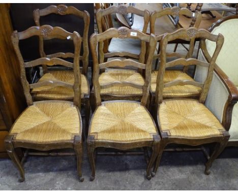 A set of 6 French oak ladder-back dining chairs with rush seats 
